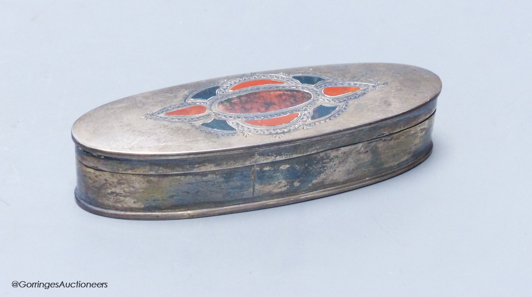 An Edwardian Scottish silver and hardstone inset oval snuff box, maker ?K, Edinburgh, 1909, 10.2cm, gross 60 grams.